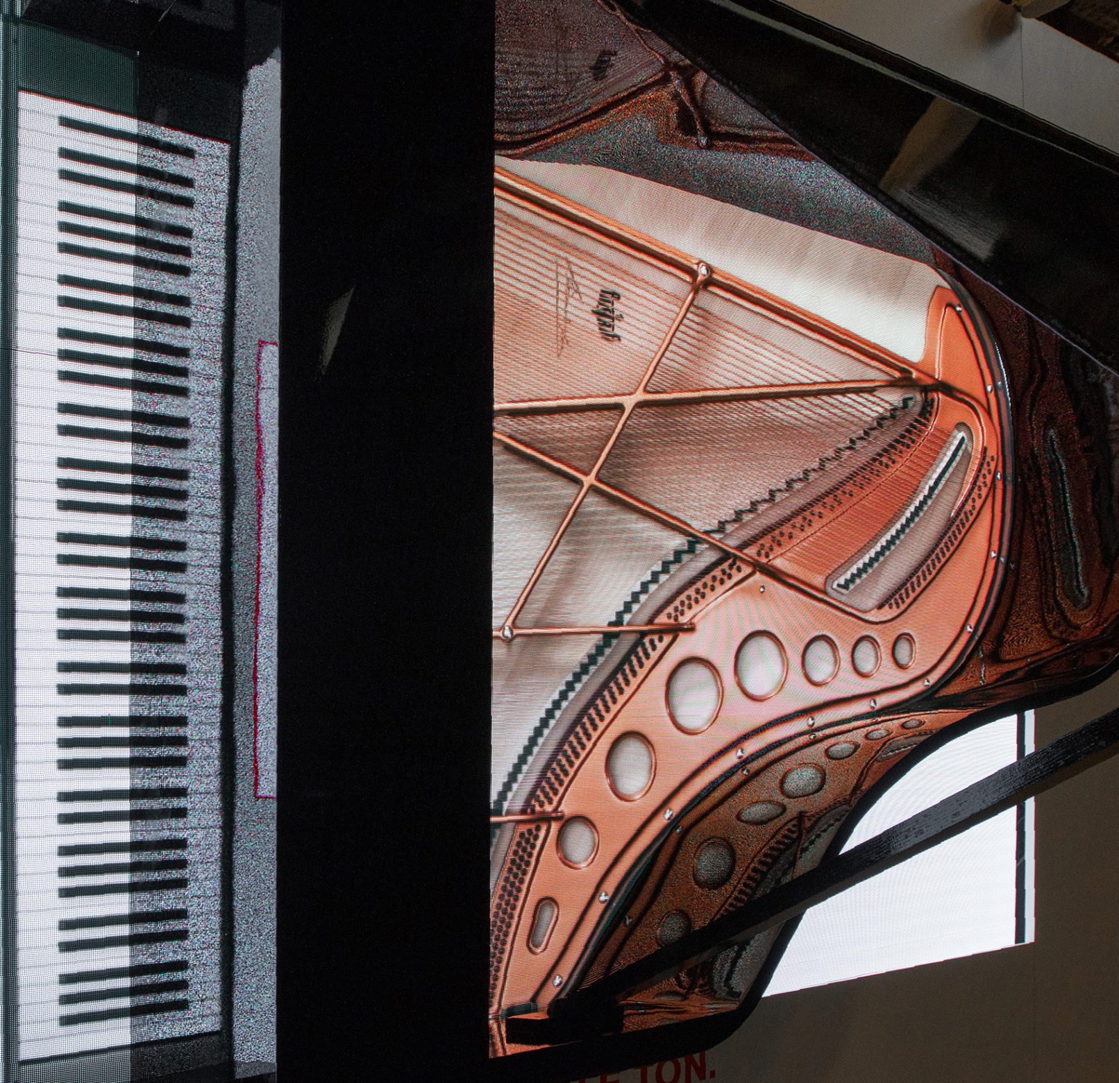 digital piano on led wall with real wood body ontop