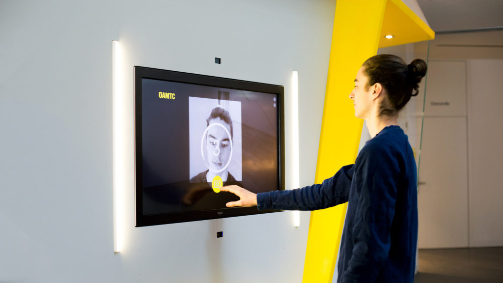 person using photostation at infotainment system